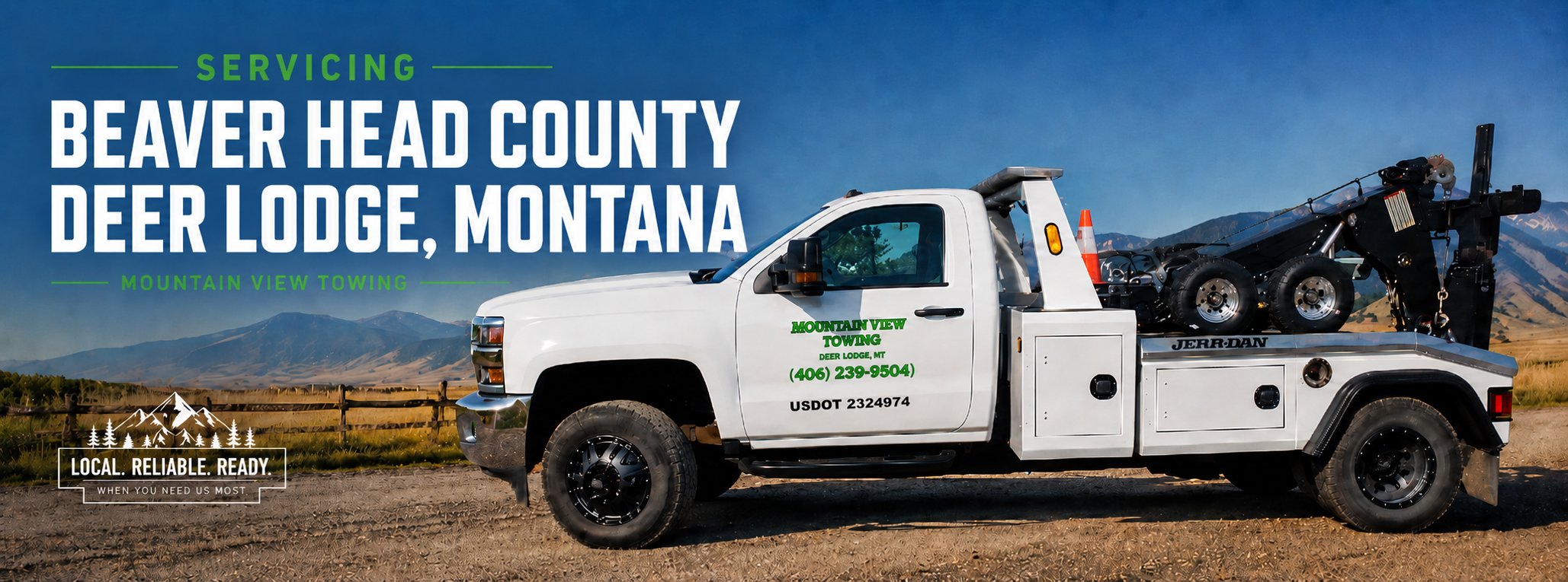 Mountain View Towing tow truck servicing Deer Lodge, Montana with mountain backdrop